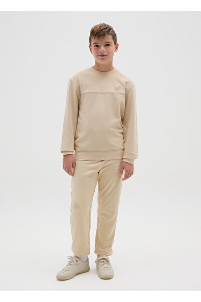 Ovs بنطلون بيج قطني خالص بقصة عادية للأولاد