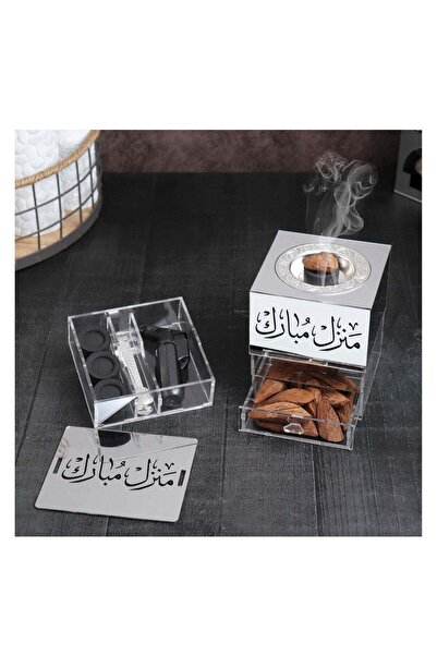 Story of candle Incense burner with a box of incense bearing the inscription "Blessed Home," along with a lighter, charcoal, and tongs for the charcoal and incense.