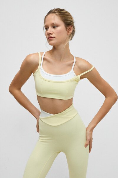 Urban Beat حمالة صدر رياضية نسائية من BLAZIX ذات ملمس مرن وناعم بنمط الفهد مع حلقة تعديل متباينة اللون وحزام أصفر