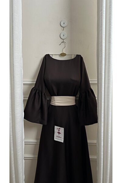 Onila Naham dress with long sleeves and a white belt