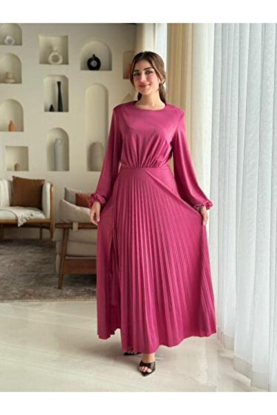 Aljouri Dress with soft pleat details and a waist-defining cut