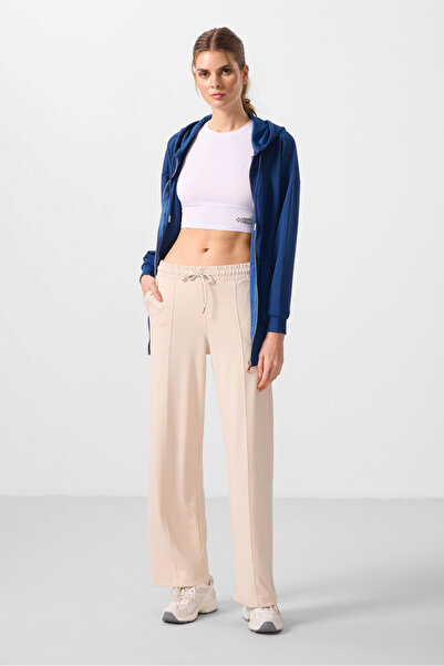 TOMMY LIFE بنطلون بالازو نسائي بيج ناعم الملمس مع جيوب وتفاصيل درزات أمامية -...