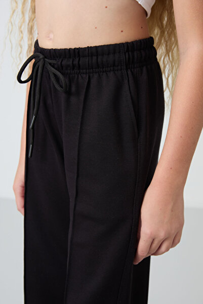 TOMMY LIFE Fekete lány melegítőnadrág széles szárral és elülső varrással -75144