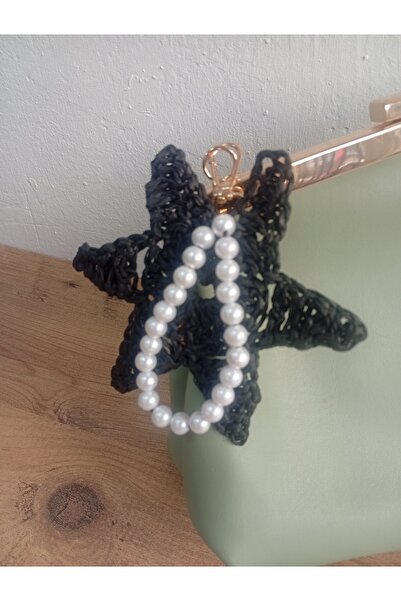 MARİANO VENANZİO Χειροποίητο πλεκτό στολίδι τσάντας σε σχήμα αστεριού με πέρλ...