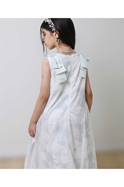 Generic Girls' dress with small glittery polka dots and viconte-shaped shoulder straps