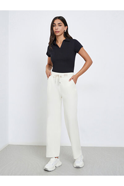 Styli بنطال بيج سادة أرجل واسعة مع رباط