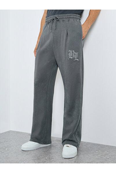 Styli بنطال رياضي رجالي رمادي سادة قصة فضفاضة