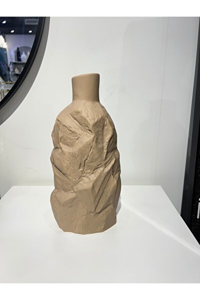 bity thok Ceramic vase with a rock-like design in a matte beige color.