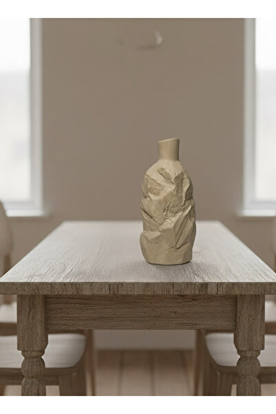 bity thok Ceramic vase with a rock-like design in a matte beige color.