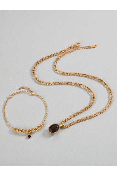 NEW STYLE A luxurious stainless steel accessory set consisting of a necklace and bracelet with black onyx pendants, presented in an elegant box.