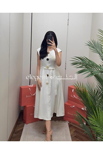 Elegent An elegant white dress adorned with colorful roses – a soft and luxurious design for special occasions.