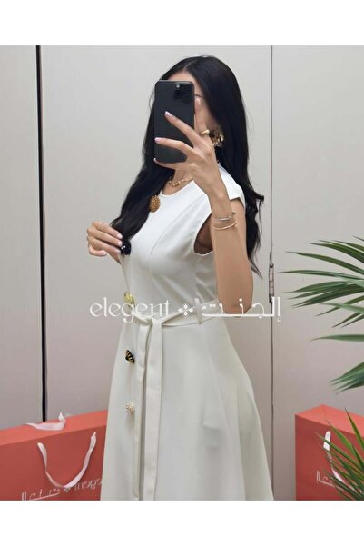 Elegent An elegant white dress adorned with colorful roses – a soft and luxurious design for special occasions.