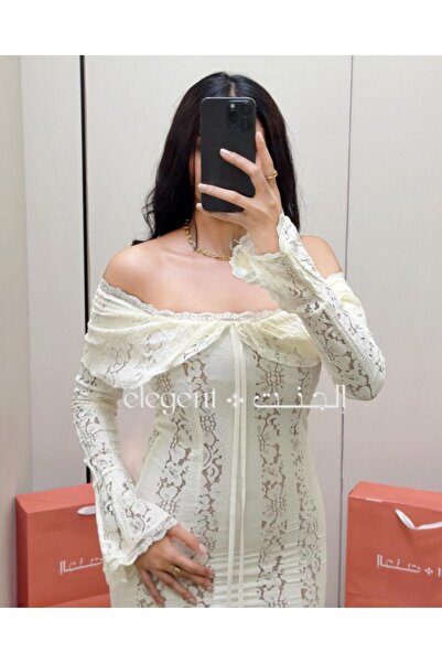 Elegent White off-shoulder lace dress with long sleeves, featuring an attractive feminine design.