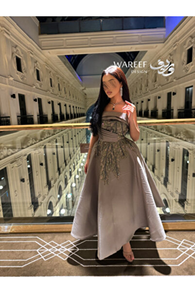 MAC CENTER A gray-to-mauve dress with shimmering embroidery and a pleated A-line skirt.