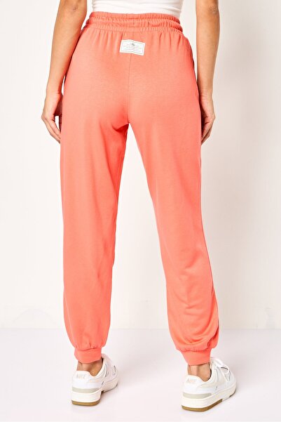 Nike Women Loose Fit Embroidered Logo Outdoor Sweatpants, Dark Peach