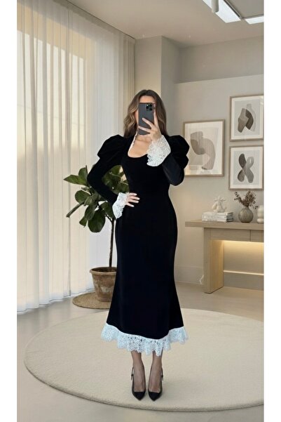 MASHN This elegant dress offers a touch of classic luxury with charming details and delicate lace.