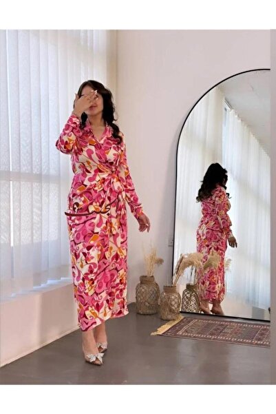 Elegent A soft wrap dress with an elegant pink artistic print, long sleeves, and a waist tie.