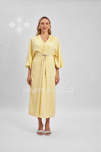 Elegent Yellow jalabiya with wide sleeves and floral detailing on the shoulder