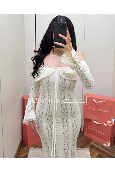 Elegent White off-shoulder lace dress with long sleeves, featuring an attractive feminine design.