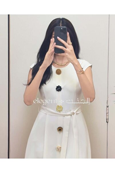 Elegent An elegant white dress adorned with colorful roses – a soft and luxurious design for special occasions.