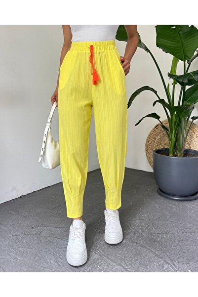 Modamorfo Trousers with dart stitched hem and lace detail