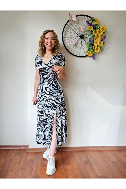 MADAME MELEK Сукня з V-подібним вирізом, довгим розрізом і короткими рукавами в смужку