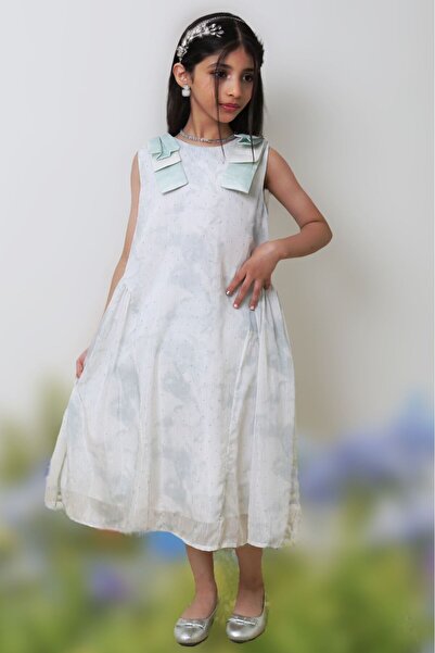 Generic Girls' dress with small glittery polka dots and viconte-shaped shoulder straps