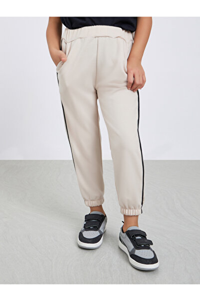 Styli Girls Beige Solid Joggers with Side Binding