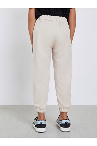 Styli Girls Beige Solid Joggers with Side Binding