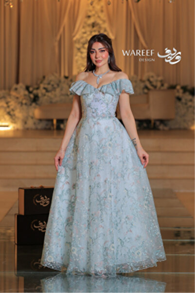 WAREEF FASHION فستان سماوي اوف شولدر مزين بالشك المورد
