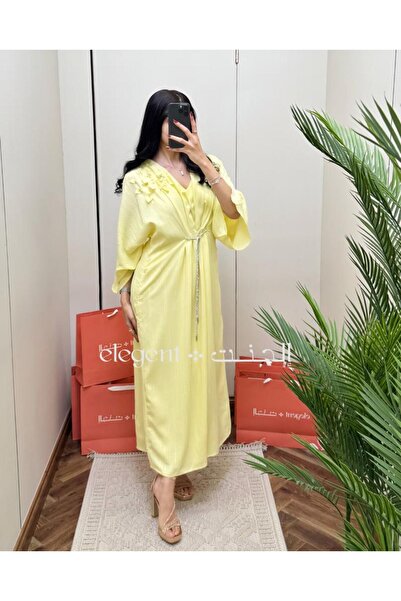 Elegent Yellow jalabiya with wide sleeves and floral detailing on the shoulder