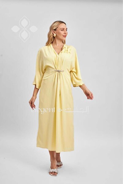 Elegent Yellow jalabiya with wide sleeves and floral detailing on the shoulder