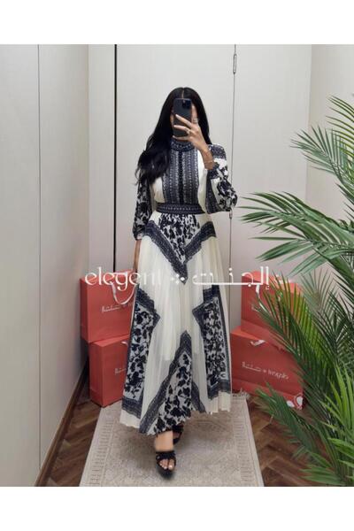 Elegent Long white chiffon dress adorned with an elegant black pattern