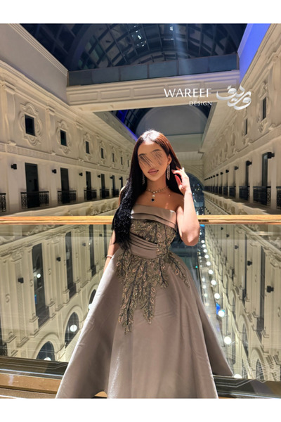 MAC CENTER A gray-to-mauve dress with shimmering embroidery and a pleated A-line skirt.