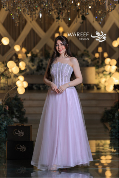 MAC CENTER A luxurious tulle evening gown with an embroidered corset design and soft pastel colors.