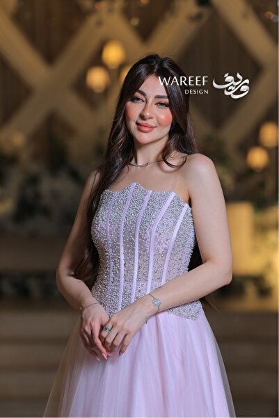 MAC CENTER A luxurious tulle evening gown with an embroidered corset design and soft pastel colors.