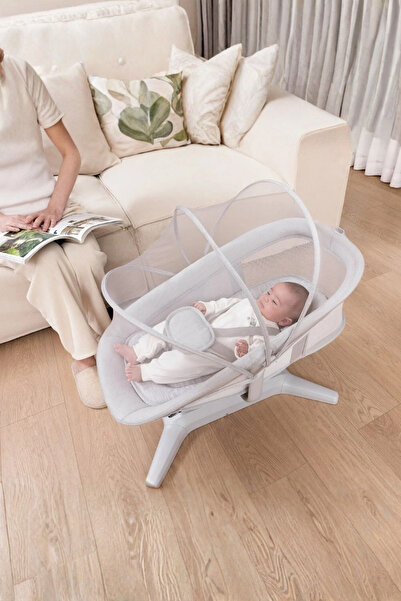 Mastela The latest Mastella 7-in-1 rocking bed with multiple positions, mobile connectivity, and rocking chair and bed design.