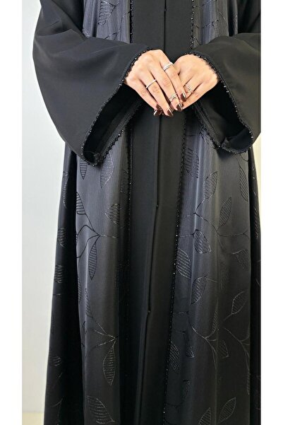 REİNA Jacquard abaya, full flared design with crepe internet lining and sleeves decorated with sequins.