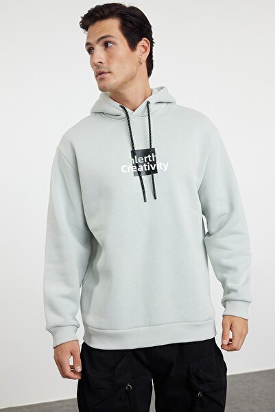 Trendyol Collection Šedá oversize/široký střih mikina s kapucí s dlouhým rukávem a potištěným textem na zádech TMNAW24SW00220