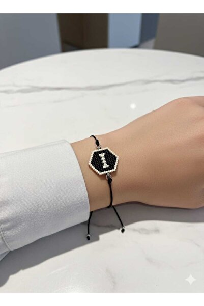 Takıcınız سوار ميوكي مكتوب عليه حرف