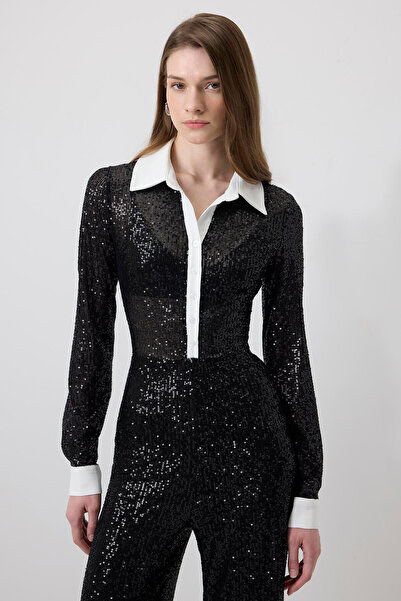 Touché Privé Jumpsuit with Front Patch, Sequin Detail, and Tulle.