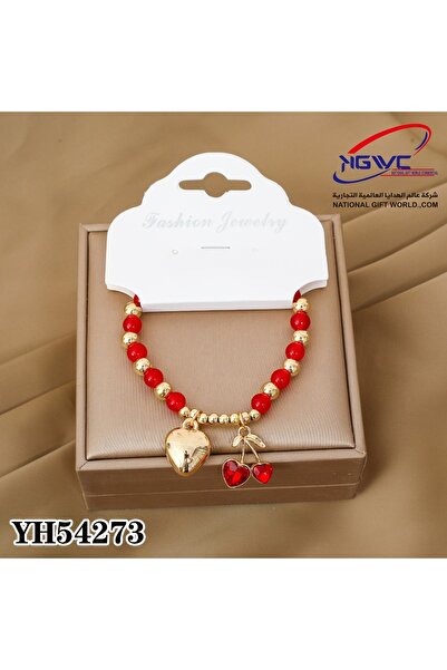 KAZUKO Pearl and gold beaded bracelet with a lip and cherry pendant.