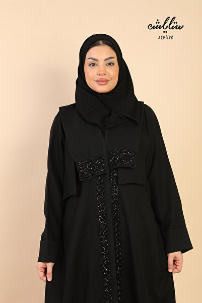 Stylish A Kuwaiti wrap abaya decorated with beading.