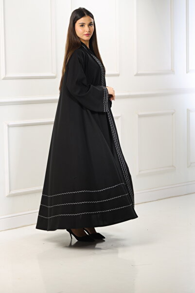 ZAHRA Black open-front abaya with a double-layered flared design, adorned with white woven lines made from internet fabric - a serene design with meticulous details.