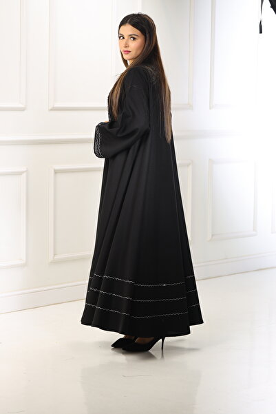 ZAHRA Black open-front abaya with a double-layered flared design, adorned with white woven lines made from internet fabric - a serene design with meticulous details.