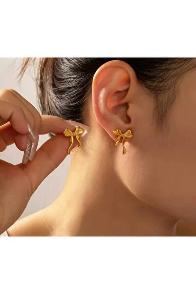 naaksesuar أقراط ذهبية اللون بتفاصيل فيونكة