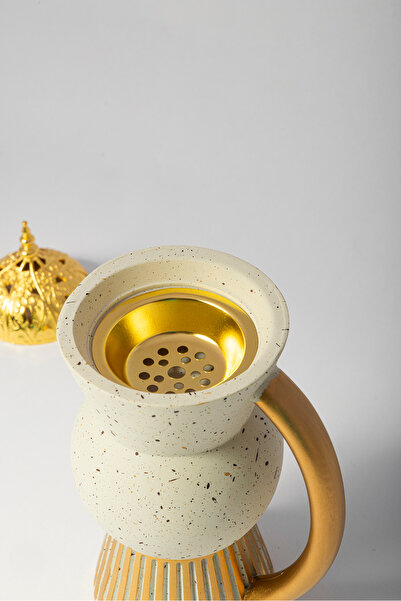 Bin Shihon Poly incense burner in the shape of a beige jug with gold