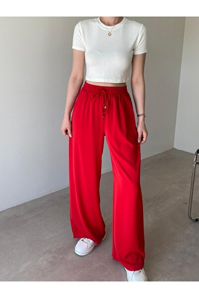Bade Butik بنطلون أريا واسع الساقين بتفاصيل جيب حمراء