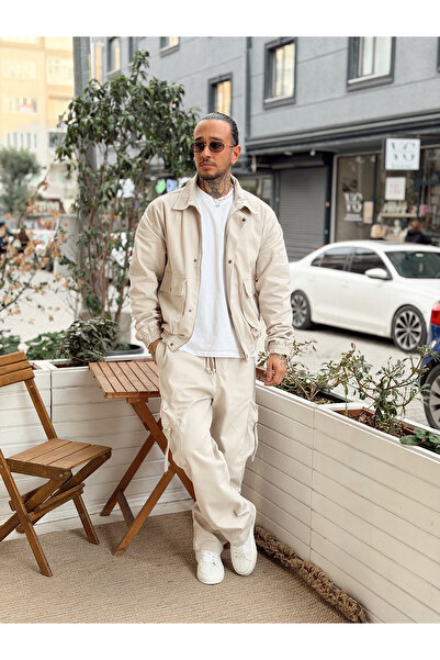 manch collection طقم سترة وبنطلون من قماش الغبردين بلون كريمي