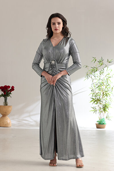 FUN BY AL BAYADER فن A shimmering silver evening dress with a gathered silhouette and an elegant front slit.